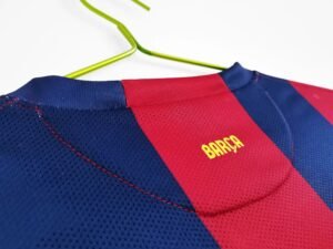 2014/15 Barcelona Home Messi #10 Jersey, worn by Lionel Messi during the 2014/15 season, featuring the iconic FC Barcelona colors and Messi's legendary #10.
