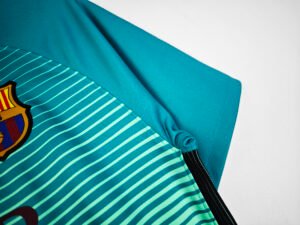 Barcelona 2016/17 Messi third jersey, featuring the iconic Barça #10 design in the club’s vibrant away colors.